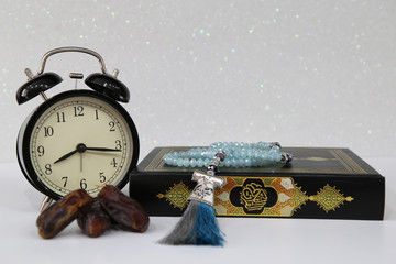 Three months.Islamic Holy Book Quran under soft light on White Background. Ramadan concept . The...