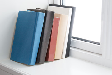 books in windowsill
