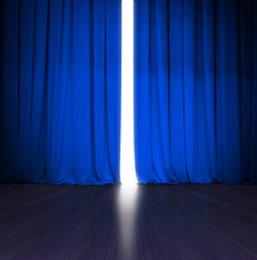 theater blue curtain slightly open with bright light behind and wood stage or scene