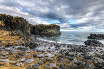 A beautiful Icelandic landscape and sea with a dramatic cloudscape in mid march