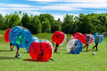 Foto op Canvas  Children playing  in Bubble Football © Shmel