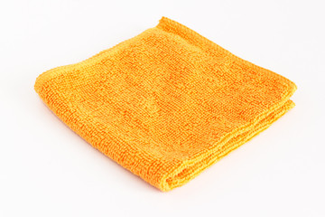 Orange folded microfiber cloth on white background - 198479358
