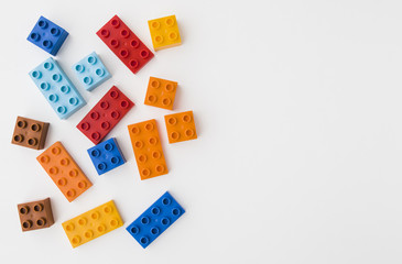 colorful toy bricks on white background