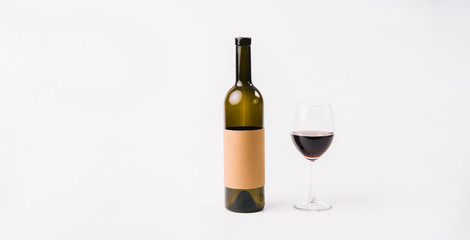 Wine bottle mock-up and glass of red wine