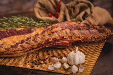 whole-smoked pork rib on rustic table