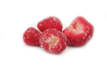 Frozen strawberries isolated on white background