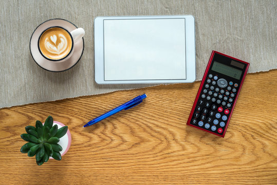 Template of financial accounting desk with calculator and tablet from above