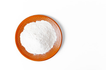 Fototapeta na wymiar Flour on plate isolated on white
