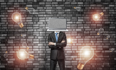 Businessman with laptop instead of head.