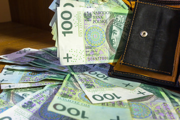 Wallet full of hundred zloty banknotes