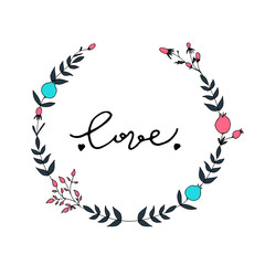 Floral wreath with love lettering.