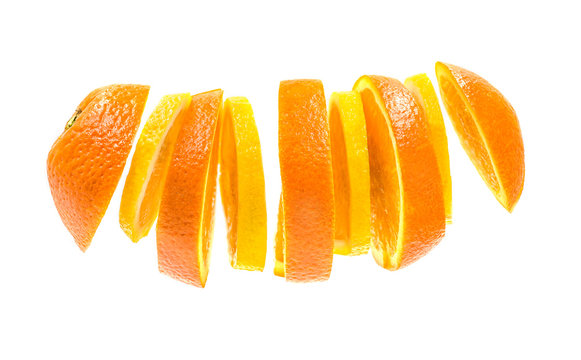 sliced flying orange and lemon isolated on white background. orange and lemon mixed pieces formone fruit. lemon and orange creative mix