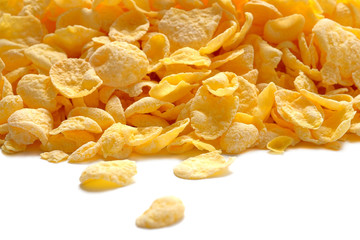 Heap of cornflakes isolated on white. Top view.