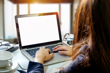 A man hand holding smart phone device in the bright office room interior.
