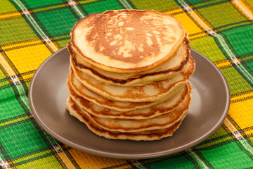Stack of homemade pancakes on plate