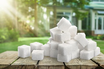Cubes of sugar on desk