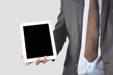 Man holding tablet pc with blank screen isolated on white background professionally