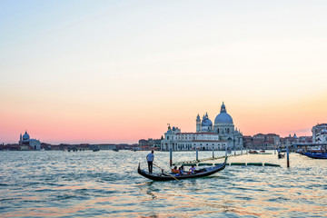 Red sunset view to a family cruising in gondola boa © frimufilms