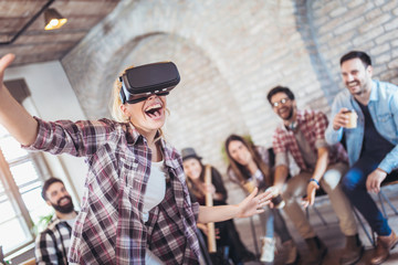 Business people making team training exercise during team building seminar using VR glasses