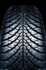Clean Tyre. Black new shiny car tire background.