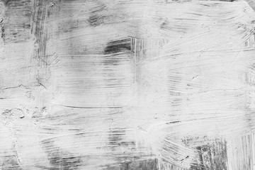 Abstract art background from white color painted on black wood background. Retro or vintage backdrop.