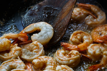 Tiger prawns are being fried on a pan