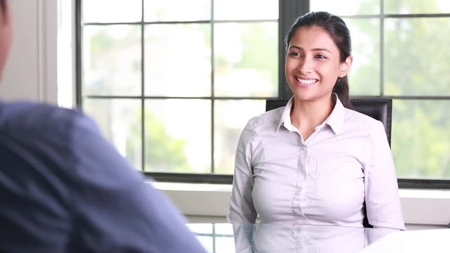 Closeup portrait, appointment with office manager, job interview, hiring, isolated indoors office background. Getting that first job or excellent customer service with a smile
