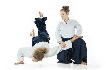 Fototapeta premium Man and woman fighting at Aikido training in martial arts school