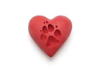 Red heart with dog paw print  over white background with clipping path