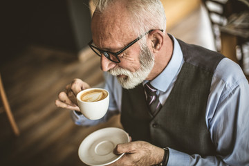 Sometimes we need break from hard business. Senior businessman.