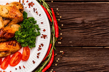 Chicken wings grilled with spices and chili pepper
