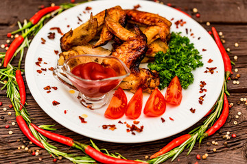Chicken wings grilled with spices and chili pepper