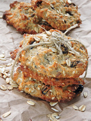 Homemade oatmeal cookies with raisins and sesame seeds and flax seeds. Fitness cookies. Oatmeal cookies and milk. The concept of a healthy breakfast with dietary oatmeal cookies.