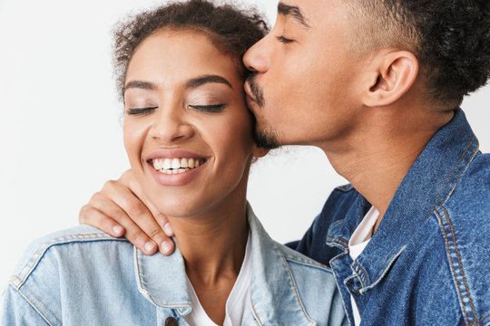 Close up portrait of a happy young african couple kissing