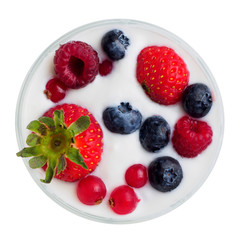 Glass with berries in milk. isolated background