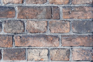 Red gray brick wall background close up  