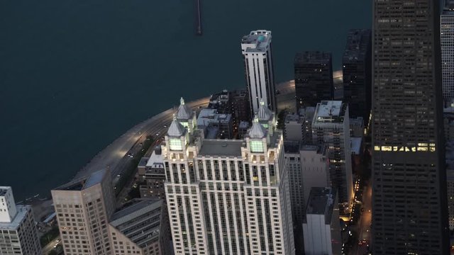Chicago telephoto aerial view approaching John Hancock Center at dusk featuring 900 North Michigan 