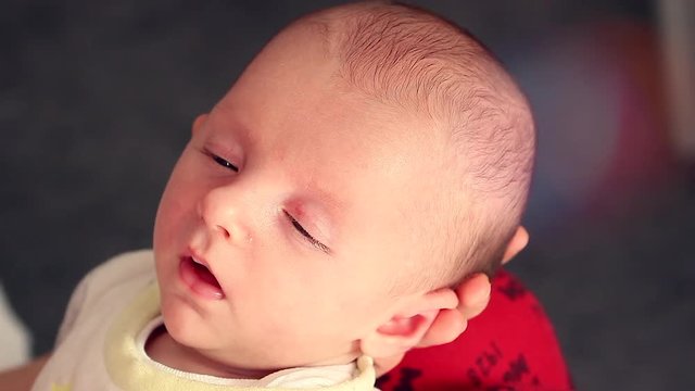 Cute Newborn Baby Boy Trying To Fall Asleep. Closeup Portrait 
