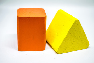 square and triagle geometry Made of wood laid on a white background.