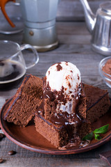 Chocolate cake with ice cream and chocolate sauce