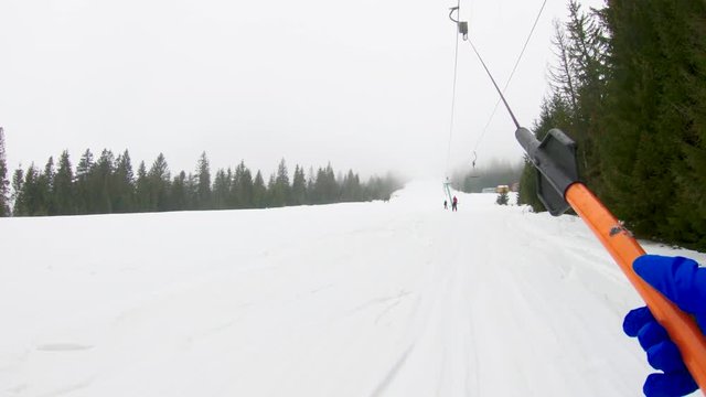 Skiing on a ski lift in Transcarpathia. Shooting on action camera, POV.