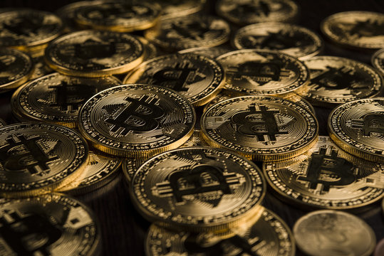 Bitcoin coin the physical bit Digital currency cryptocurrency A gold coin with a gorgeous golden bitcoin symbol. Fit your valuable work.