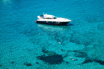 Fototapeta na wymiar luxury yacht in turquoise Illetes Formentera mediterranean sea Balearic Islands