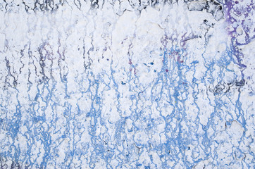 Streaks of violet and blue paint on white background