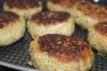Meatballs on a plate an in a pan - Frikadellen
