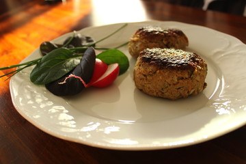 Meatballs on a plate an in a pan - Frikadellen