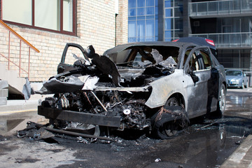 Burned car, burned-out car body, broken vehicle
