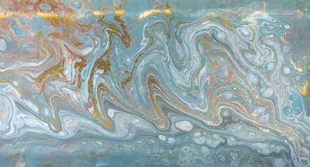 Marble abstract acrylic background. Nature blue marbling artwork texture. Gold glitter.