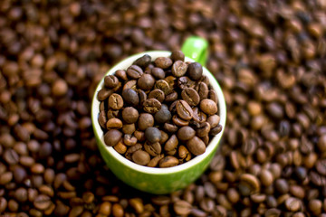 Fototapeta premium cup full of coffee beans