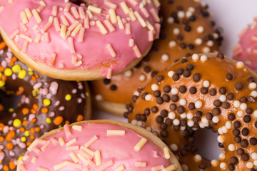Obraz na płótnie Canvas homemade donuts with chocolate and icing glaze on white background
